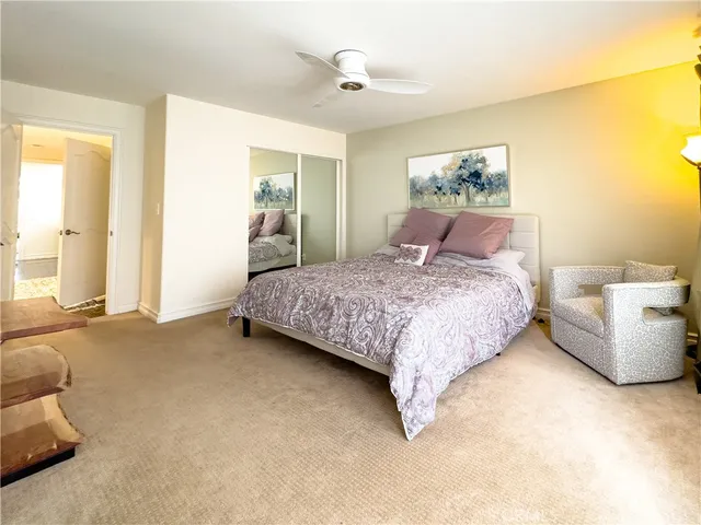 a bedroom with a bed and a couch