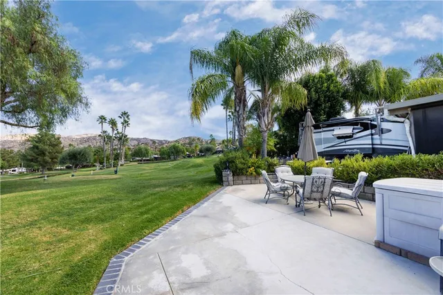 a view of a patio with a table and chairs