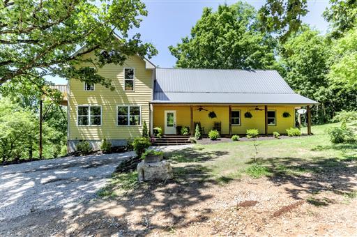 1065 Pack Cemetery Road White Bluff, TN 37187 - Photo 1 of 28 Front of home with covered rocking chair porch