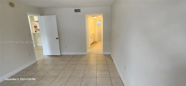 a view of a bathroom from a hallway