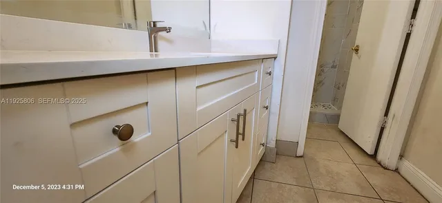 a white toilet sitting next to a shower curtain