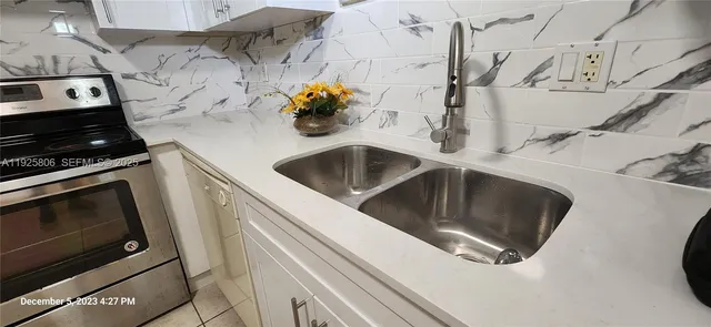 a kitchen with a stove and a microwave