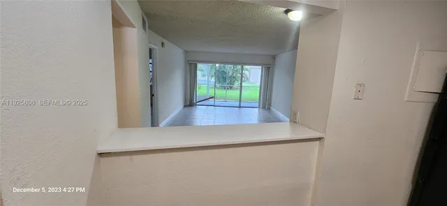 a view of a bathroom from a corridor