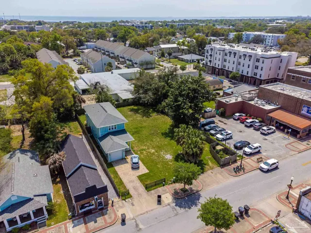 an aerial view of houses with yard