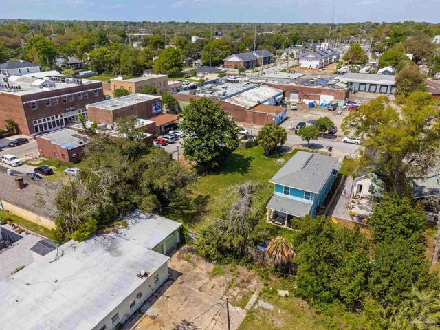 an aerial view of a house with a garden