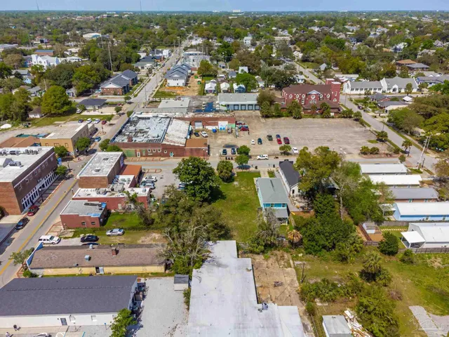 an aerial view of residential houses with outdoor space