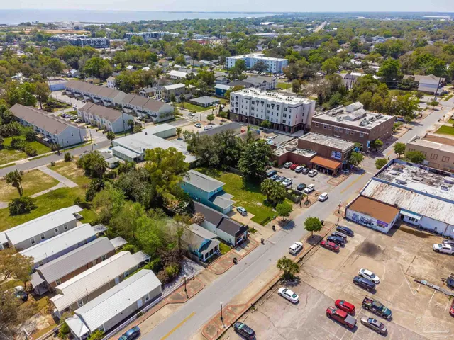 an aerial view of residential houses with outdoor space
