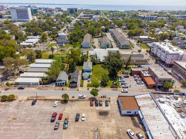 an aerial view of residential houses with outdoor space