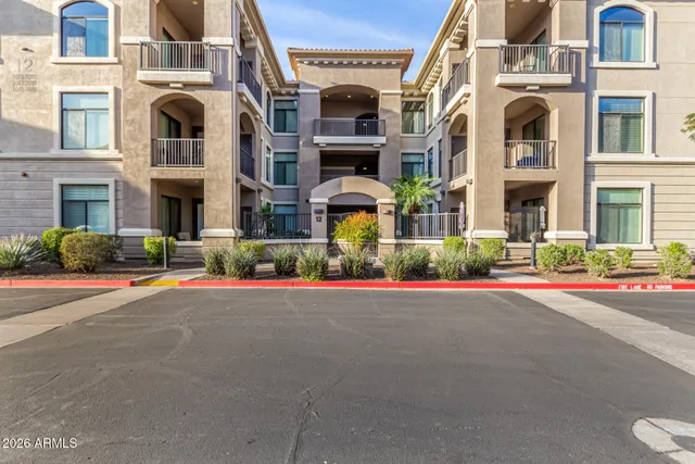a view of multiple houses with a yard