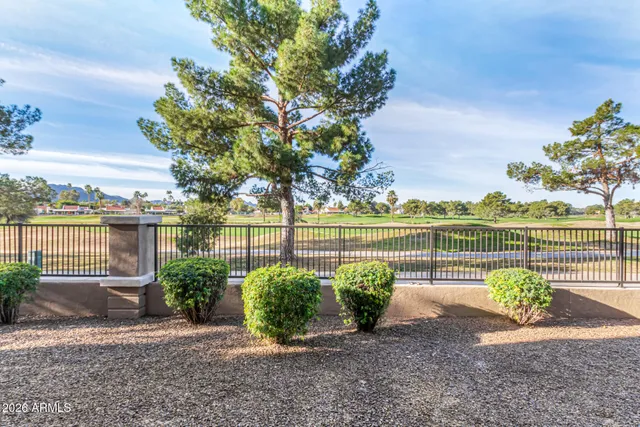 a view of a garden with an outdoor seating