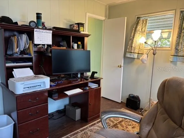 a room with furniture and wooden floor