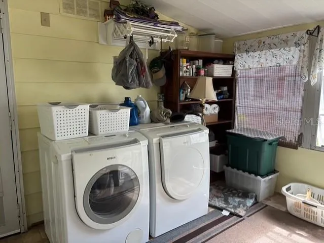 a utility room with dryer and washer
