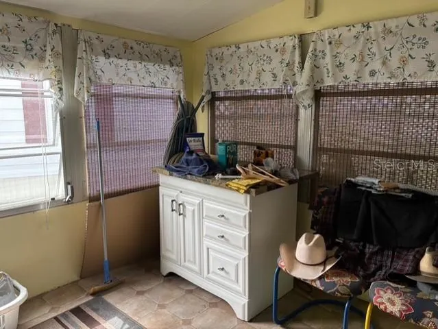 a kitchen with a sink and cabinets