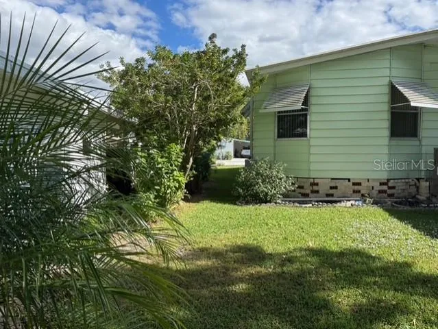 a backyard of a house with lots of green space