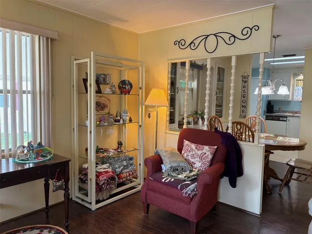 a theatre with furniture and wooden floor