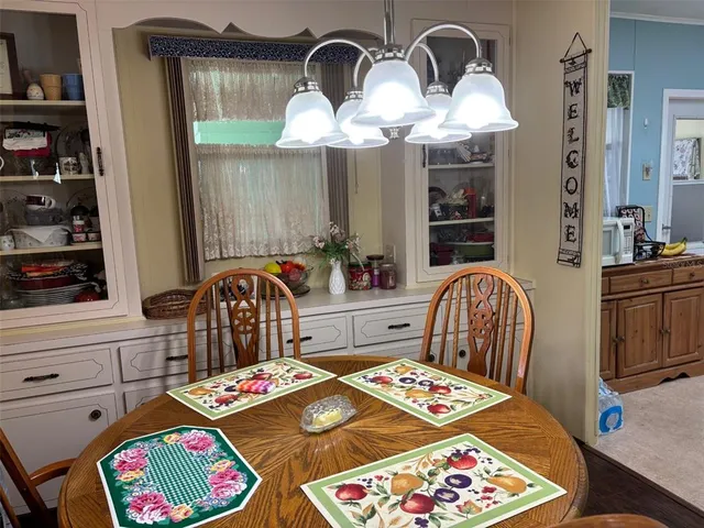 a bedroom with furniture and a chandelier