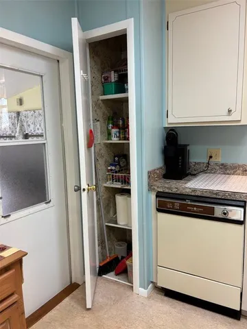 a kitchen with a stove and cabinets