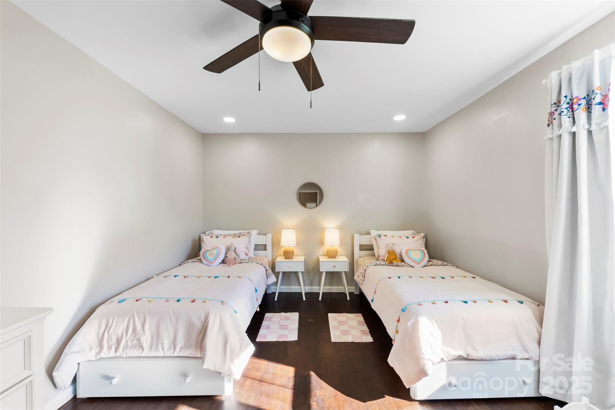 411 South Battleground Avenue Kings Mountain, NC 28086 - Photo 19 of 38 a bedroom with a bed and a chandelier
