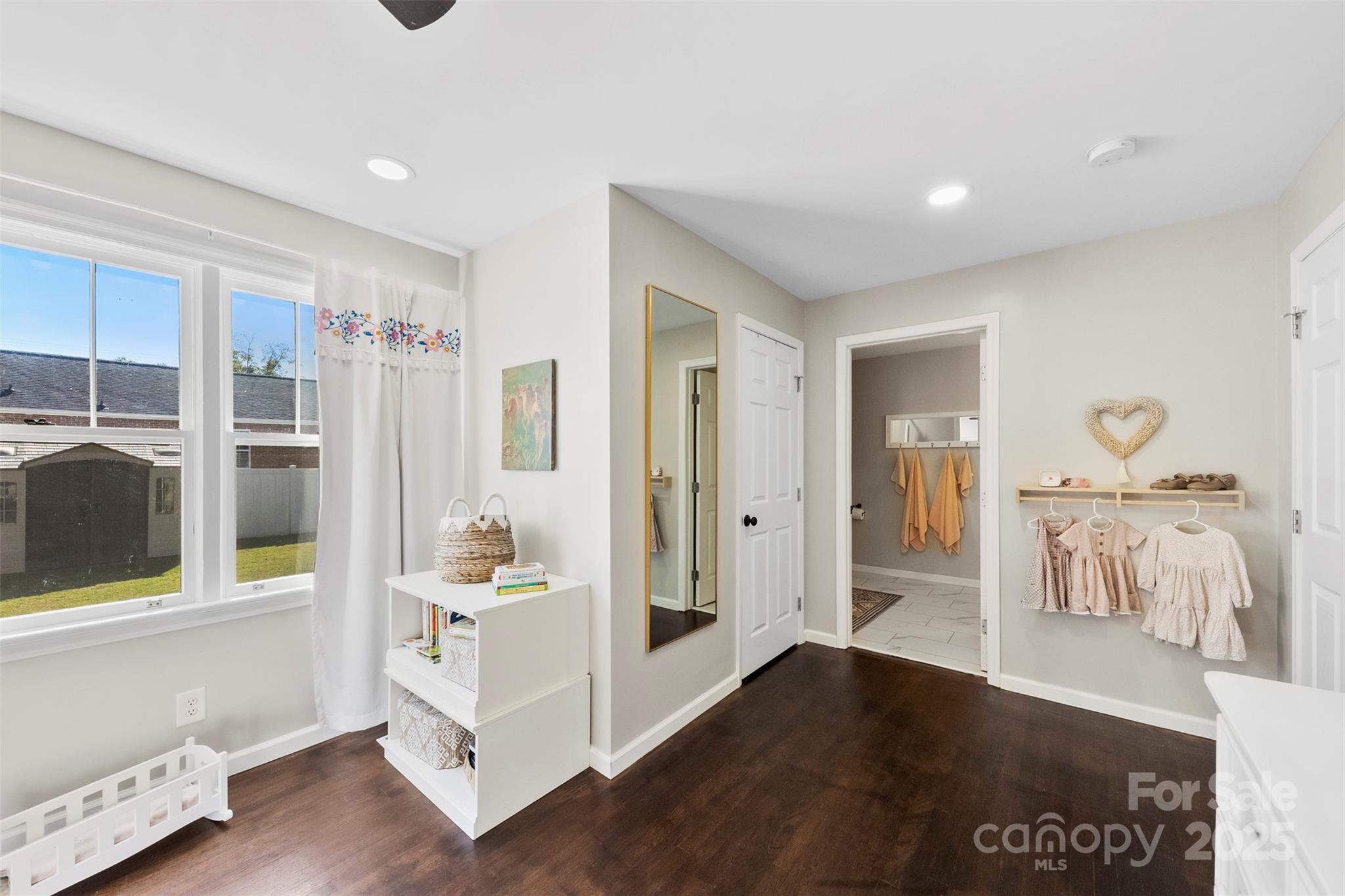 411 South Battleground Avenue Kings Mountain, NC 28086 - Photo 21 of 38 a hallway with white cabinets and wooden floor