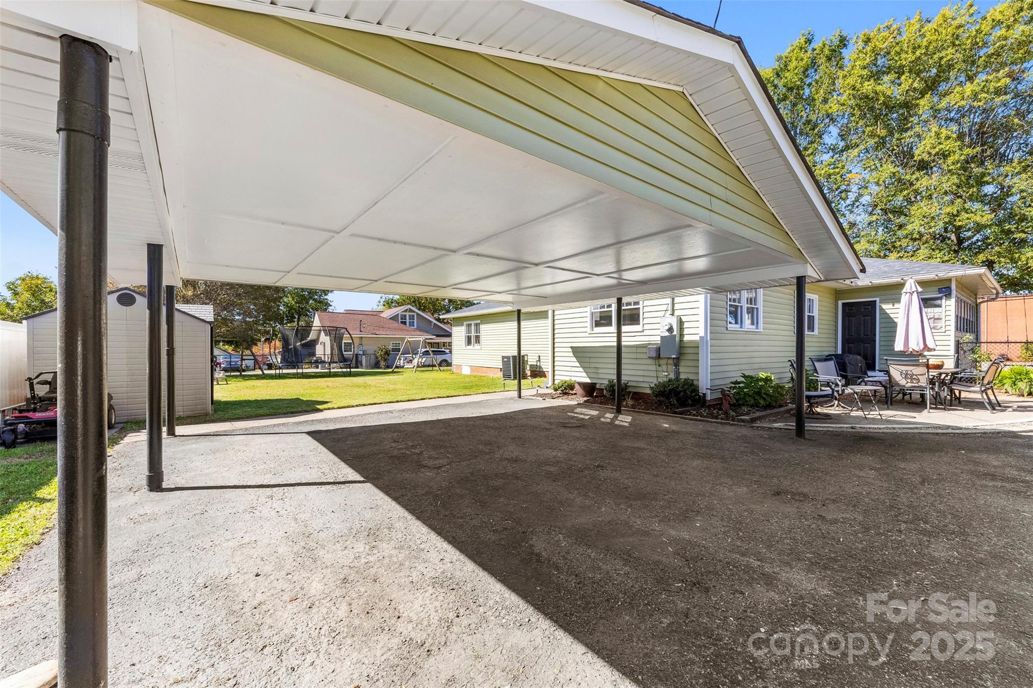 411 South Battleground Avenue Kings Mountain, NC 28086 - Photo 35 of 38 a view of backyard with wheel chair and potted plants
