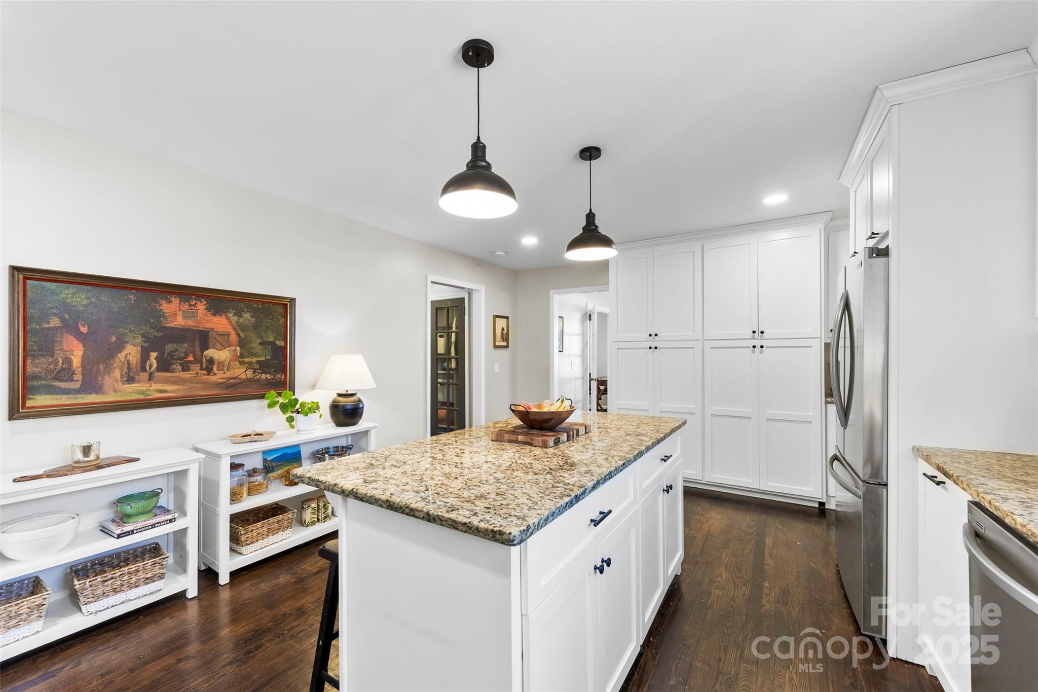 411 South Battleground Avenue Kings Mountain, NC 28086 - Photo 8 of 38 a kitchen with stainless steel appliances granite countertop a stove and a refrigerator