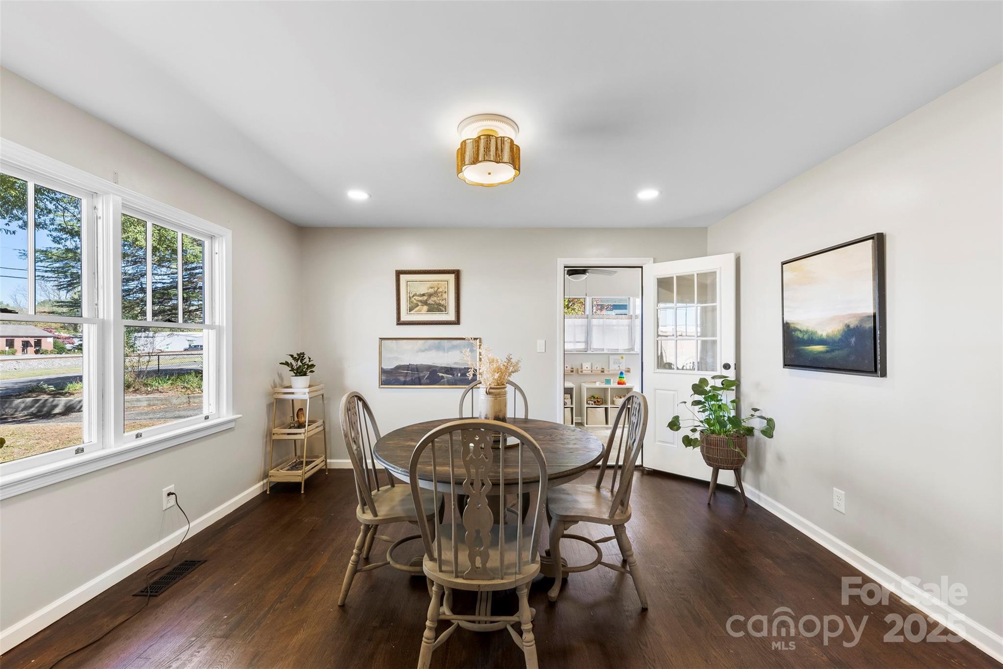 411 South Battleground Avenue Kings Mountain, NC 28086 - Photo 9 of 38 a view of a dining room with furniture window and wooden floor