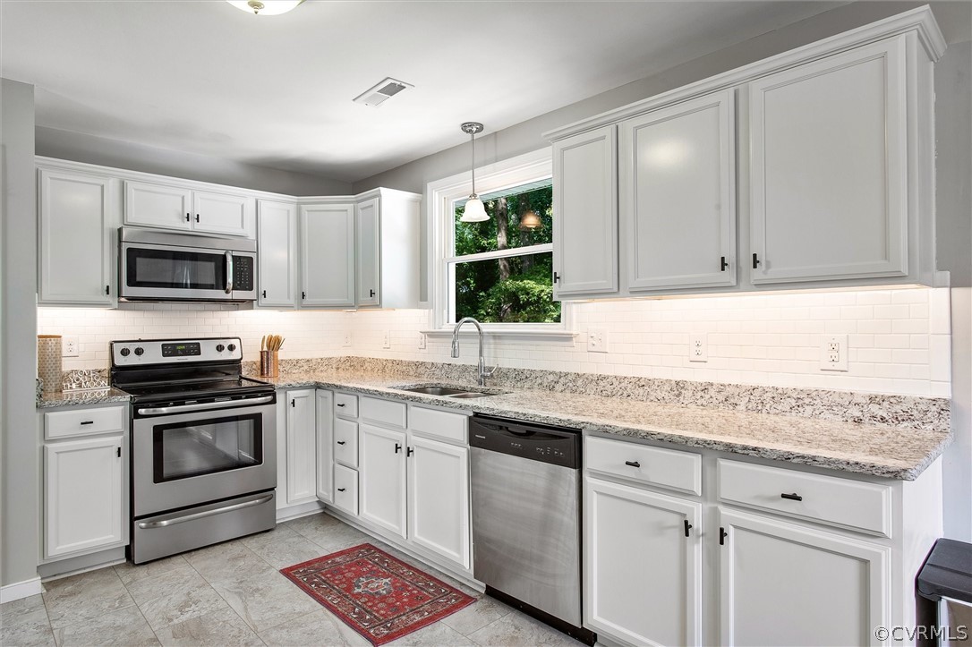 3012 Elmbrook Road Henrico, VA 23228 - Photo 10 of 32 Kitchen with granite countertops, tile backsplash,