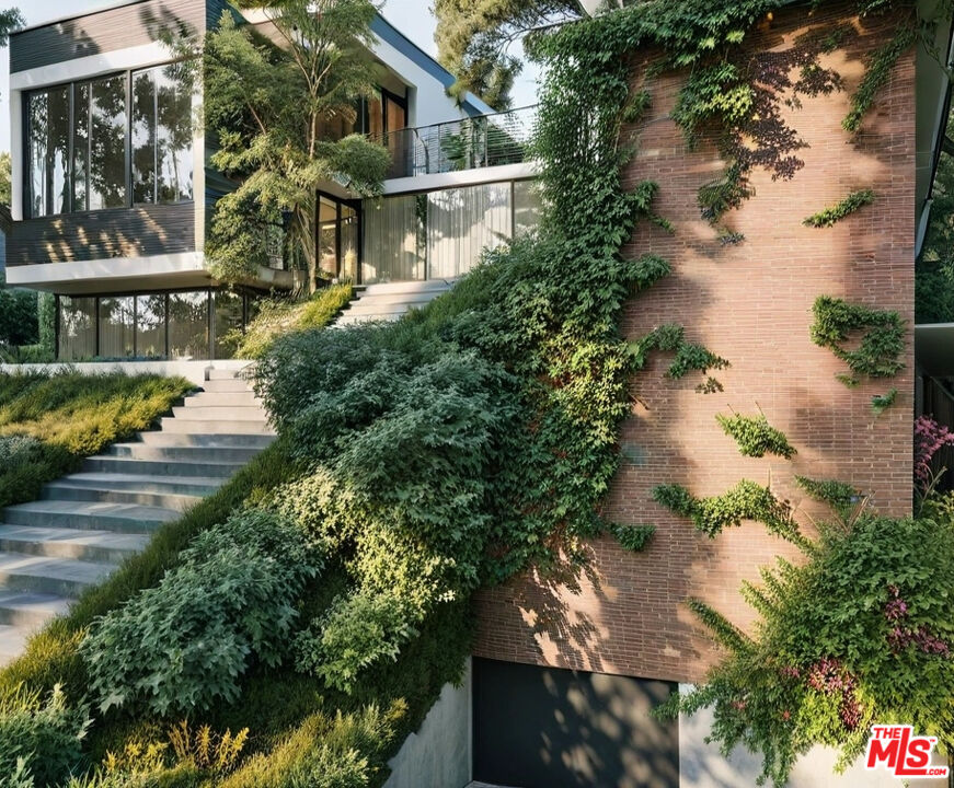 7192 Woodrow Wilson Drive Los Angeles, CA 90068 - Photo 2 of 8 an aerial view of a house with a yard and large trees