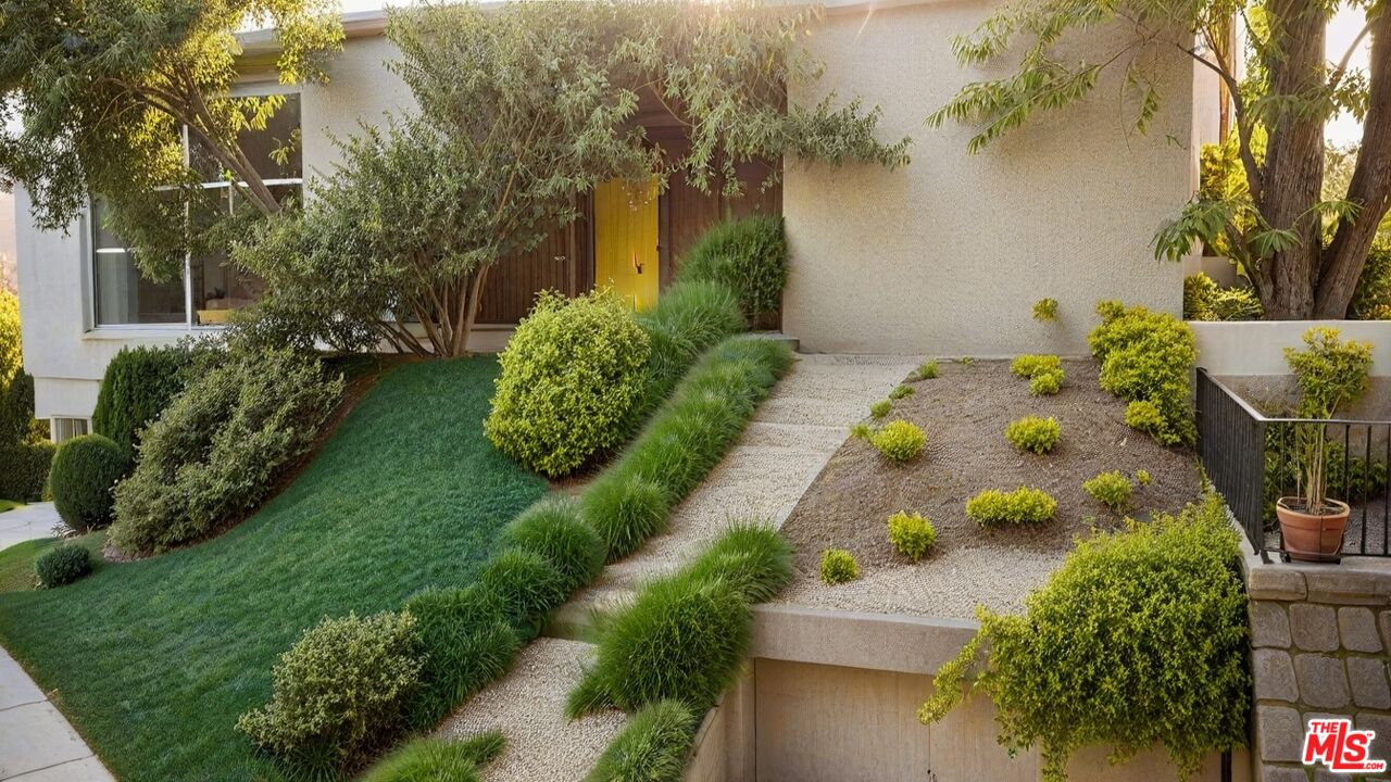 7192 Woodrow Wilson Drive Los Angeles, CA 90068 - Photo 8 of 8 a green field with flowers in front of it
