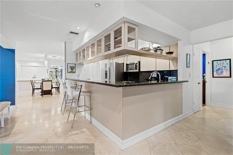3401 North 31st Terrace Hollywood, FL 33021 - Photo 14 of 35 a view of living room with furniture and kitchen view