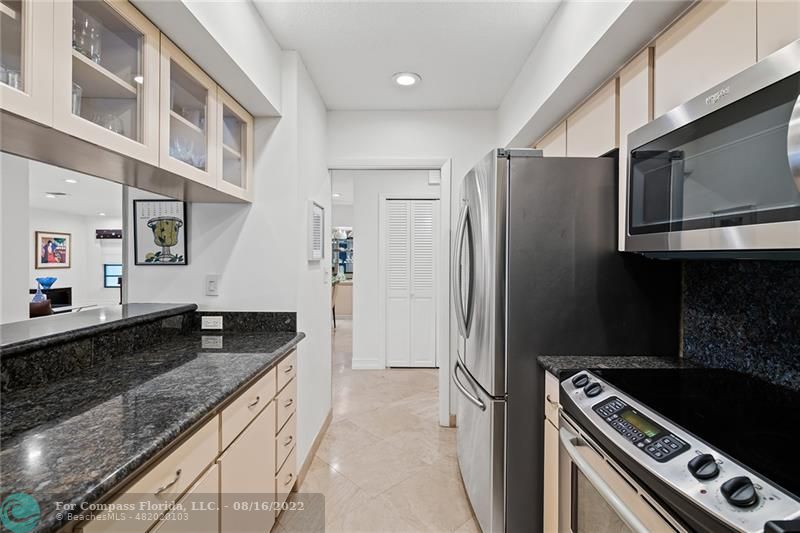 3401 North 31st Terrace Hollywood, FL 33021 - Photo 16 of 35 a kitchen with stainless steel appliances granite countertop a refrigerator and a stove