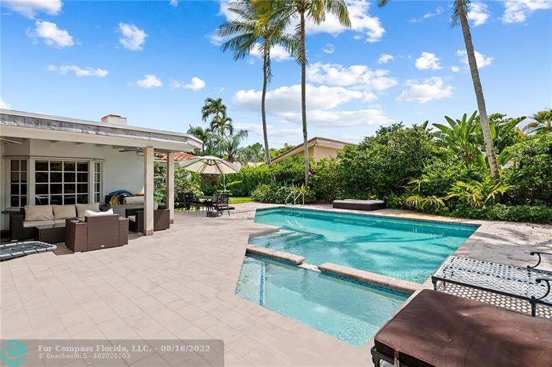3401 North 31st Terrace Hollywood, FL 33021 - Photo 2 of 35 a view of a backyard with couches plants and large tree
