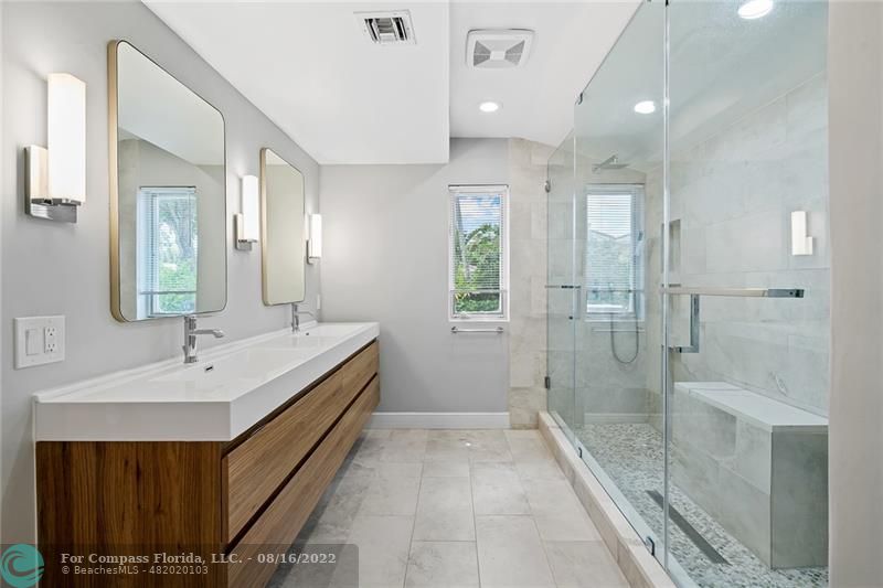 3401 North 31st Terrace Hollywood, FL 33021 - Photo 22 of 35 a bathroom with a double vanity sink mirror double and shower