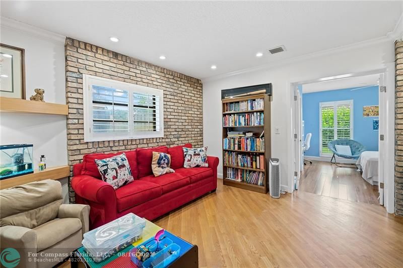 3401 North 31st Terrace Hollywood, FL 33021 - Photo 28 of 35 a living room with furniture and a book shelf