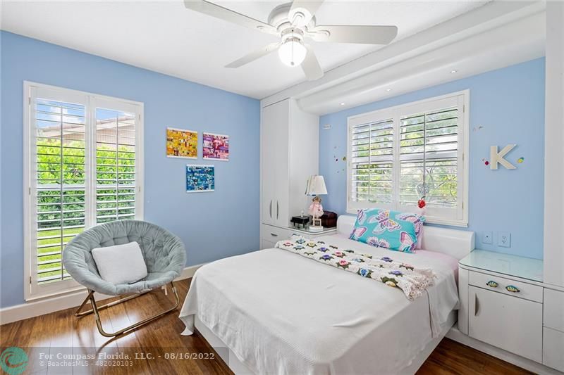 3401 North 31st Terrace Hollywood, FL 33021 - Photo 30 of 35 a bedroom with a bed and a chair