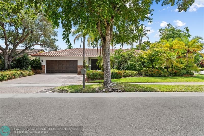 3401 North 31st Terrace Hollywood, FL 33021 - Photo 34 of 35 a front view of a house with a yard and potted plants