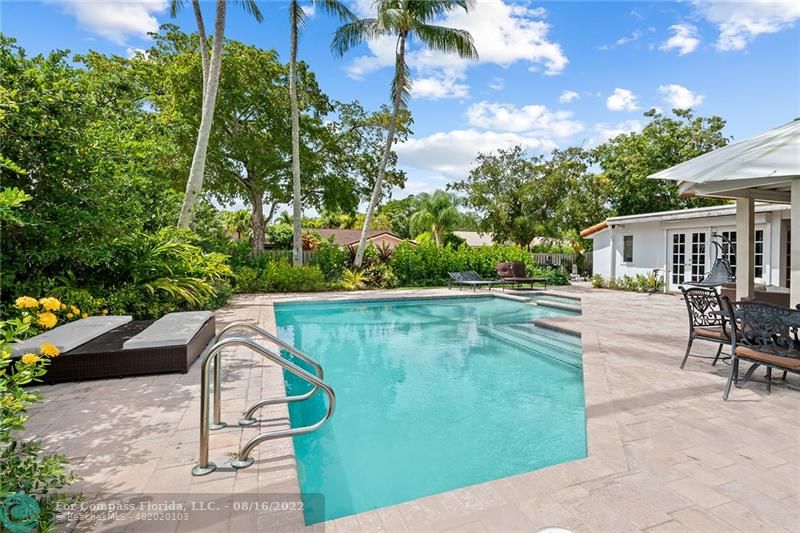 3401 North 31st Terrace Hollywood, FL 33021 - Photo 5 of 35 a view of swimming pool with outdoor seating and plants