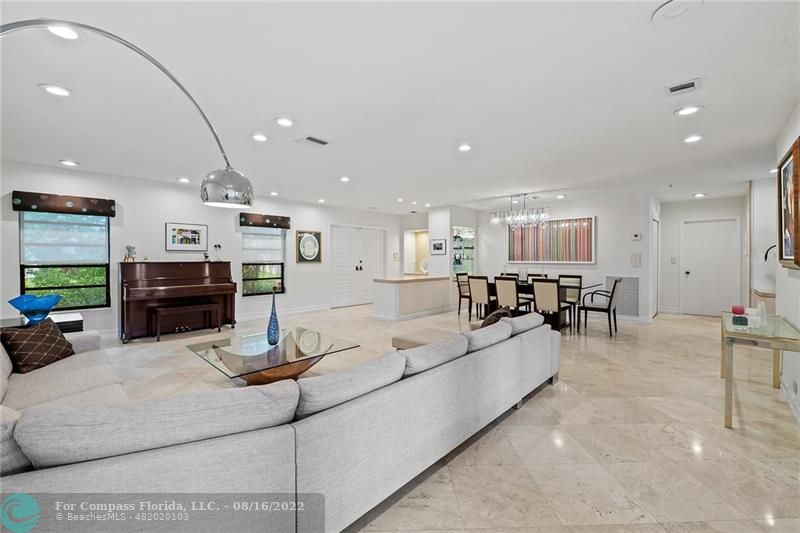 3401 North 31st Terrace Hollywood, FL 33021 - Photo 10 of 35 a living room with furniture kitchen view and a chandelier
