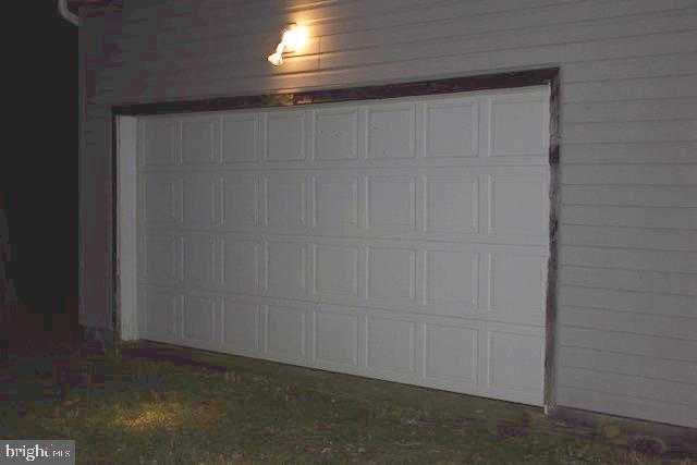 60 Policeman Club Road Falling Waters, WV 25419 - Photo 29 of 32 Detached 3 car garagehas workshop space for a