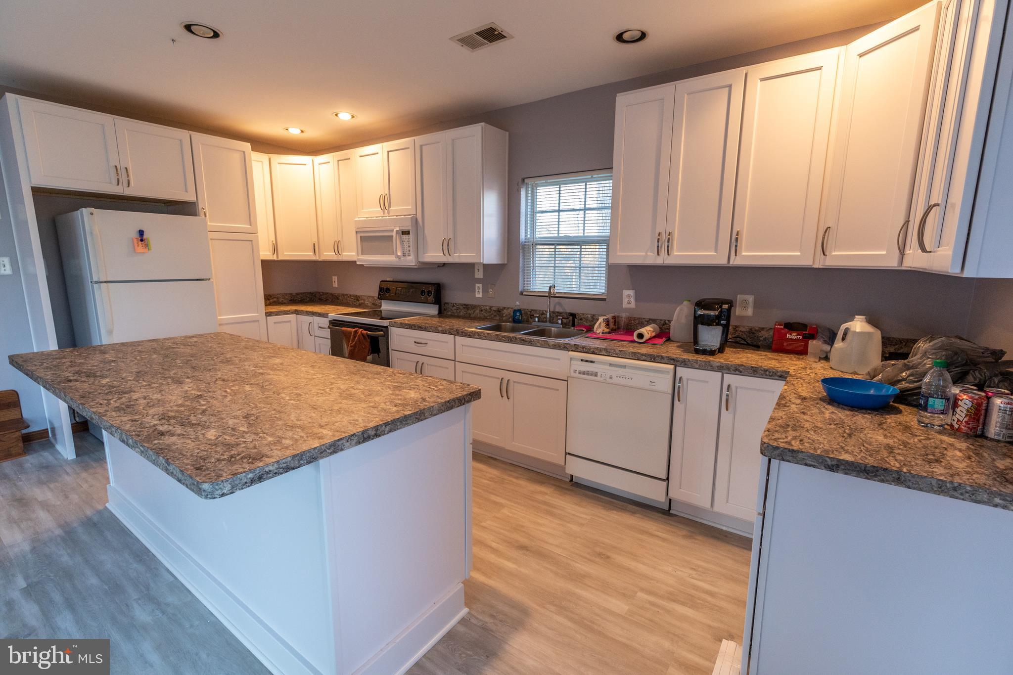 60 Policeman Club Road Falling Waters, WV 25419 - Photo 8 of 32 Breakfast bar with seating for 4