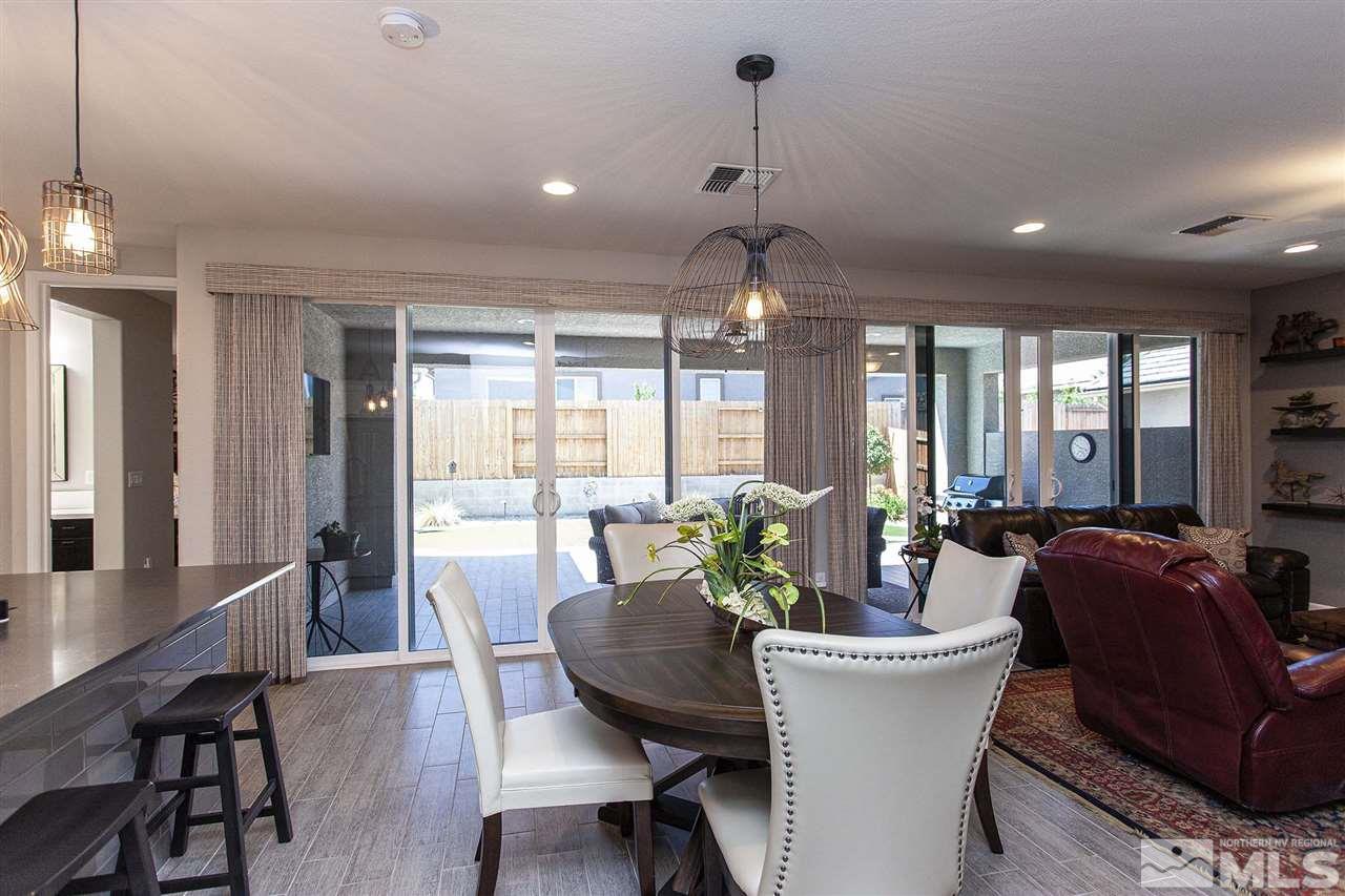 2190 Arpagos Lane Reno, NV 89521 - Photo 15 of 38 a view of a dining room with furniture window and outside view