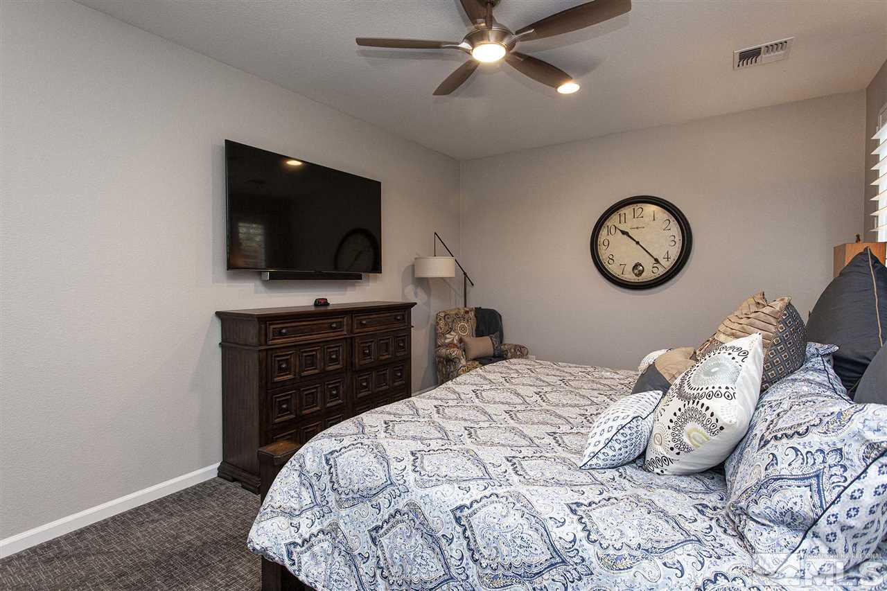 2190 Arpagos Lane Reno, NV 89521 - Photo 20 of 38 a bedroom with a bed and a television