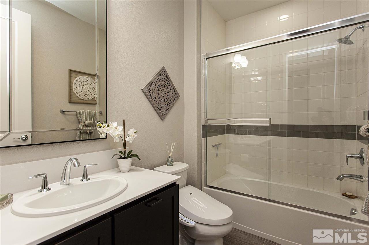 2190 Arpagos Lane Reno, NV 89521 - Photo 2 of 38 a bathroom with a sink a toilet and shower