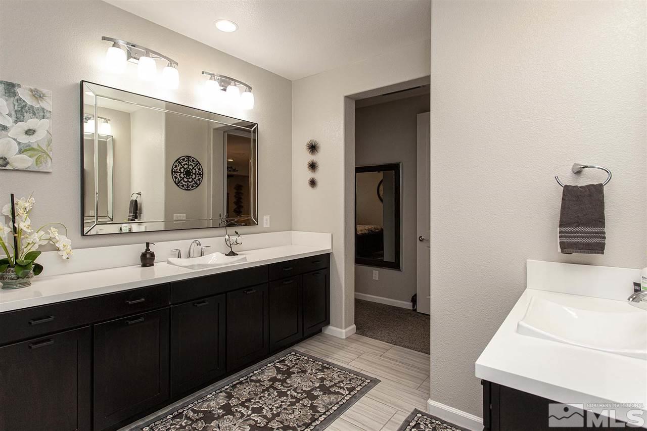 2190 Arpagos Lane Reno, NV 89521 - Photo 23 of 38 a bathroom with a double vanity sink and mirror