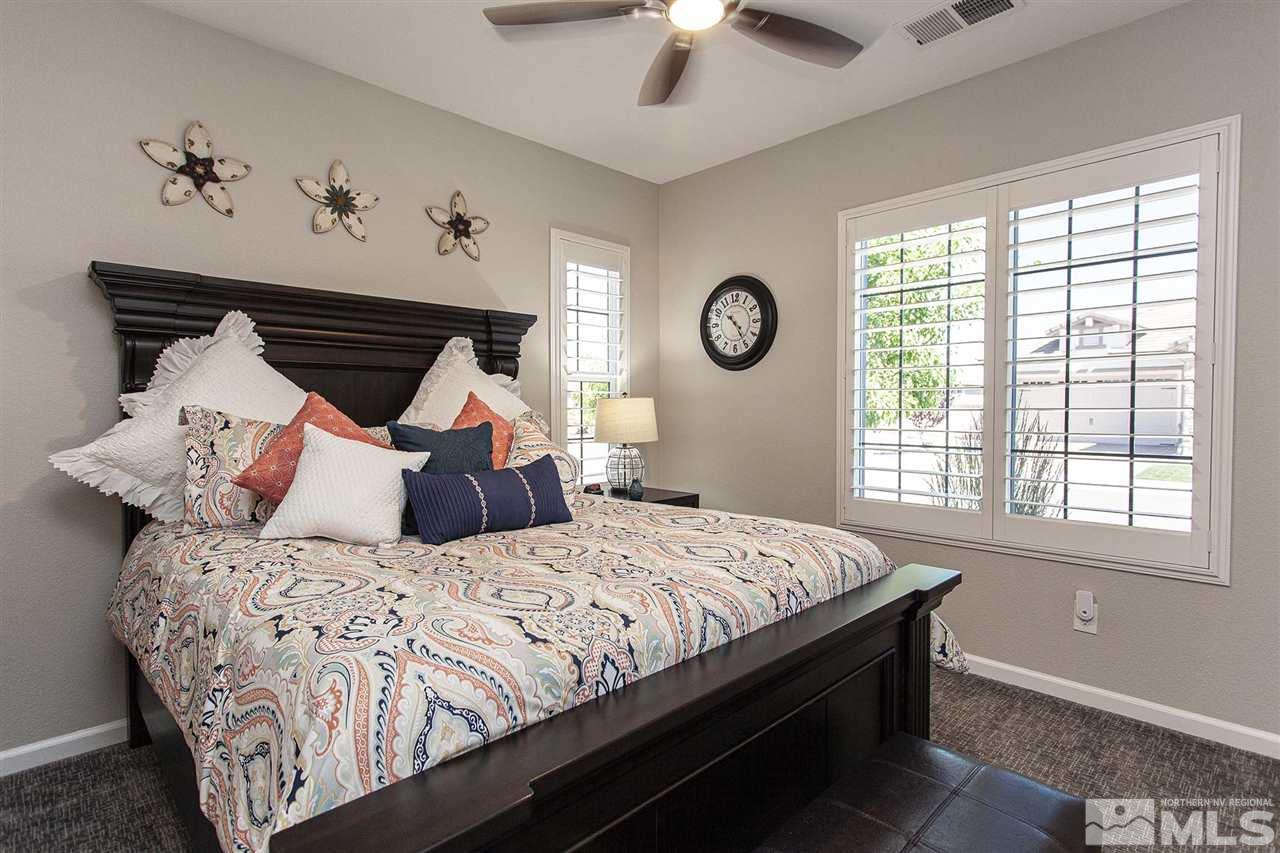 2190 Arpagos Lane Reno, NV 89521 - Photo 25 of 38 a bedroom with a large bed and a window