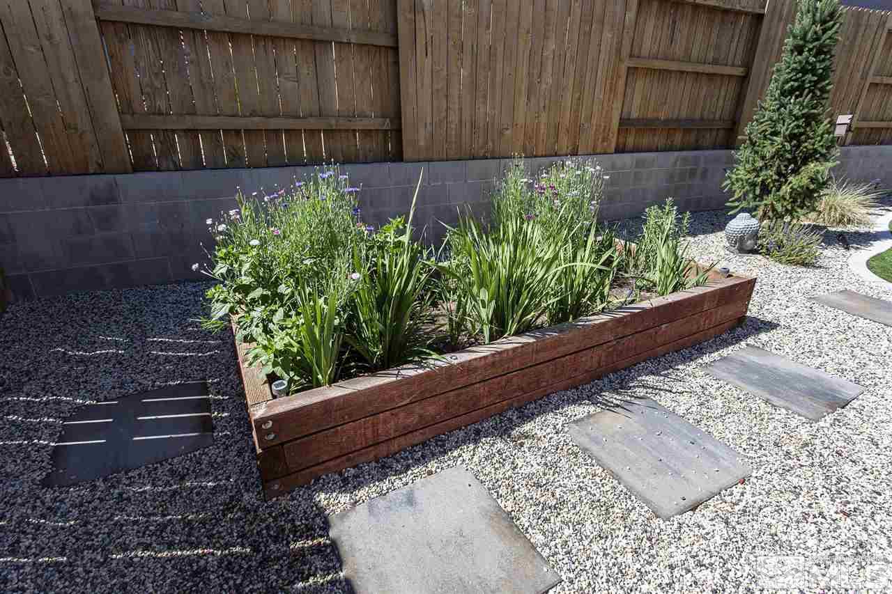 2190 Arpagos Lane Reno, NV 89521 - Photo 34 of 38 a view of a garden with wooden fence