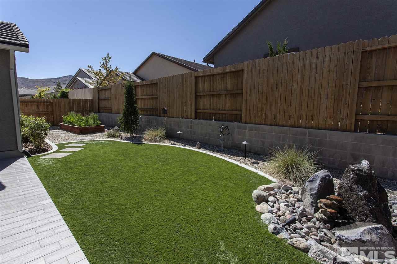 2190 Arpagos Lane Reno, NV 89521 - Photo 36 of 38 a front view of a house with a garden