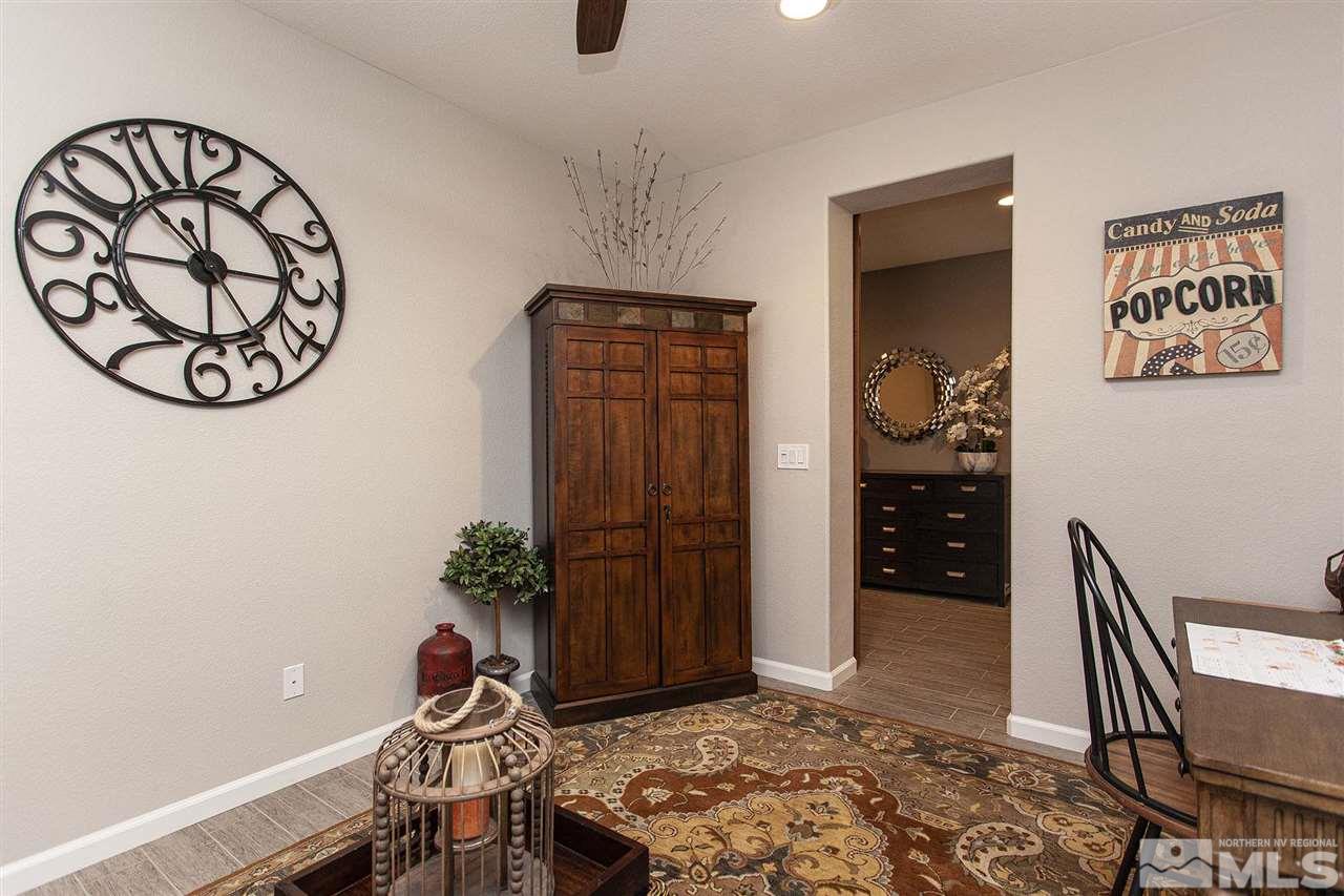 2190 Arpagos Lane Reno, NV 89521 - Photo 6 of 38 a bedroom with a table and a potted plant