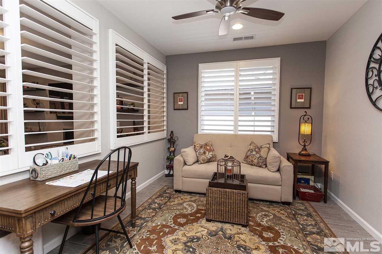 2190 Arpagos Lane Reno, NV 89521 - Photo 7 of 38 a living room with furniture and large windows