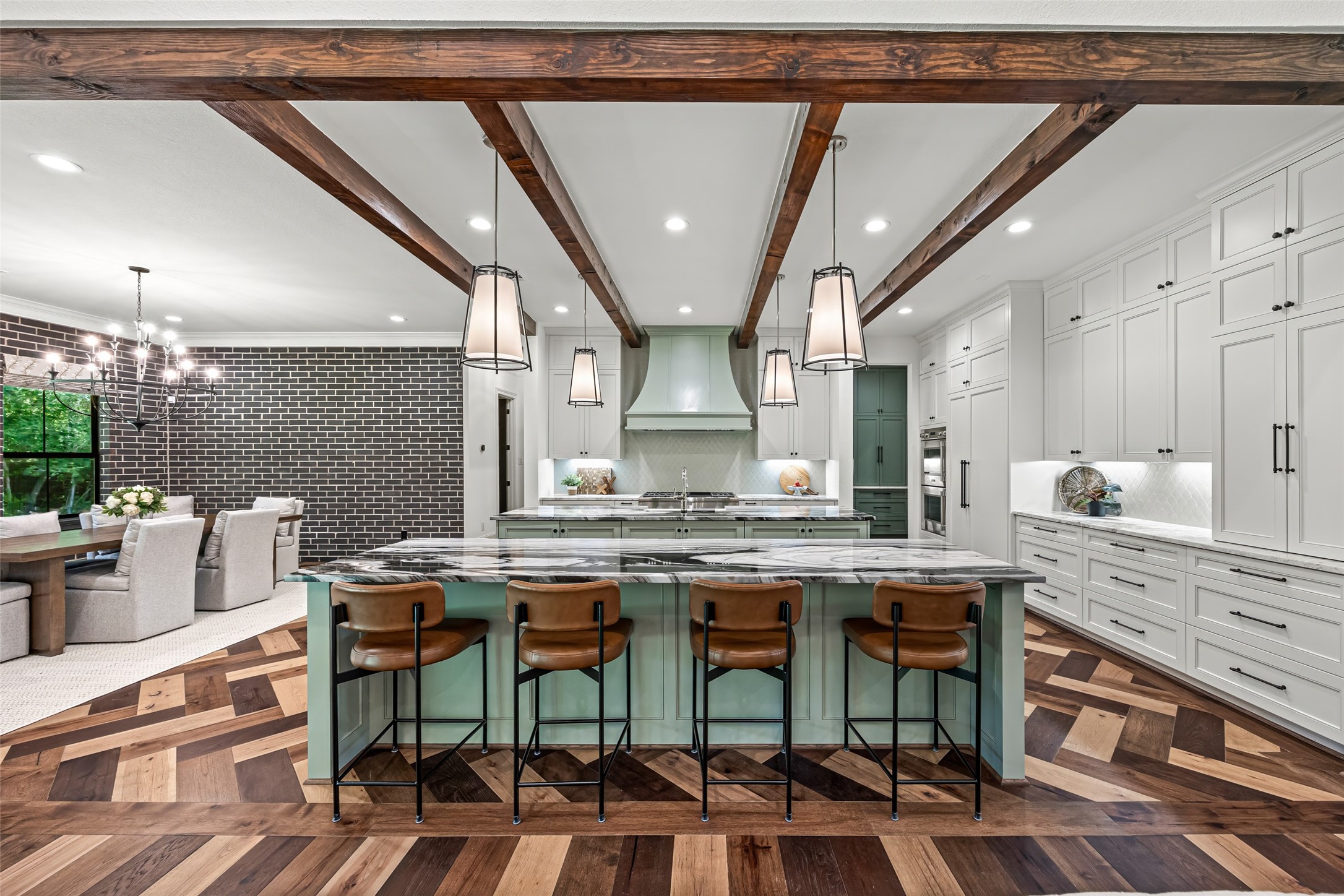 19314 Chateau Ridge Court Tomball, TX 77377 - Photo 7 of 50 Gorgeous chef’s kitchen with a bold designer island and plenty of cabinet space